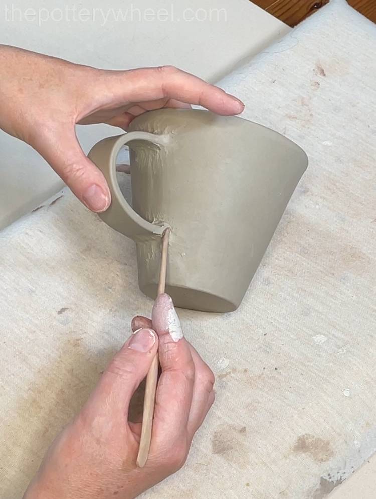 Blending the clay into the handle