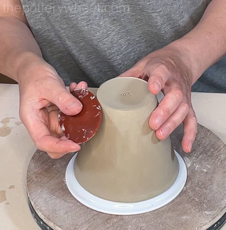 smoothing the outside surface of the slab mug