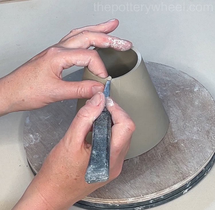 tidying the bottom of the wide rimmed slab mug