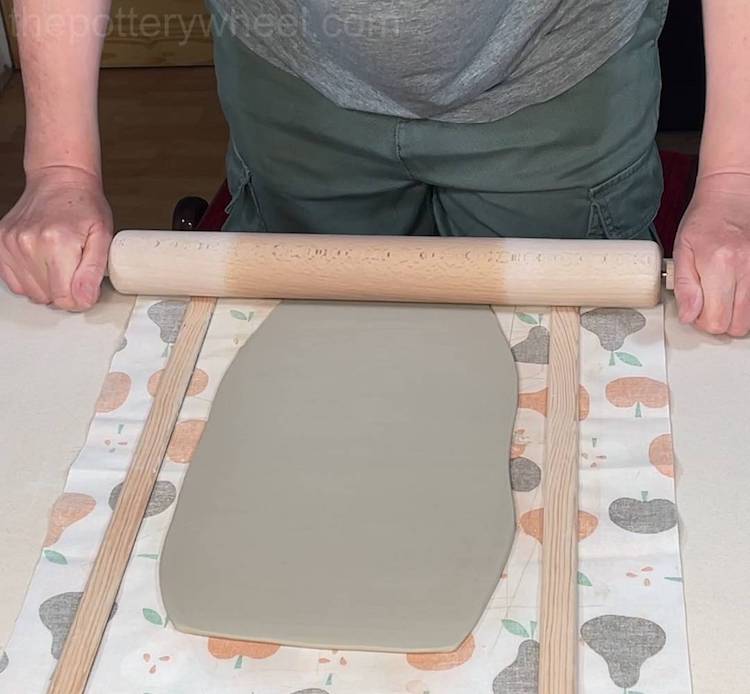 using roller guides to roll a slab
