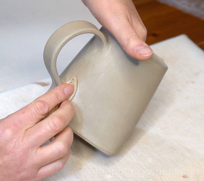 Smoothing the handle on the slab mug
