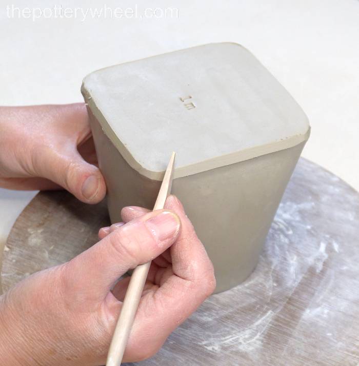 bevelling the bottom edge of the square slab mug