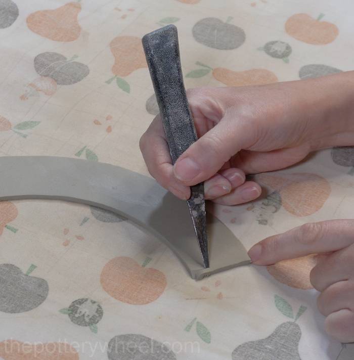 beveling the edges of the bottom part of the mug