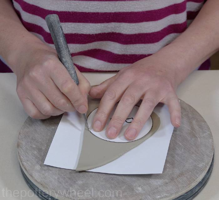 cutting out the base of the mug