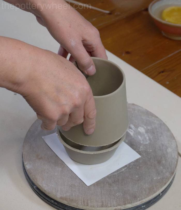 lowering the top on the base of the bellied slab mug