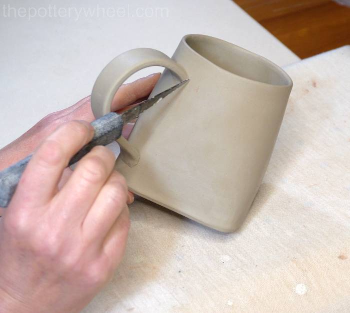 marking where the handle goes on the square bottomed slab mug