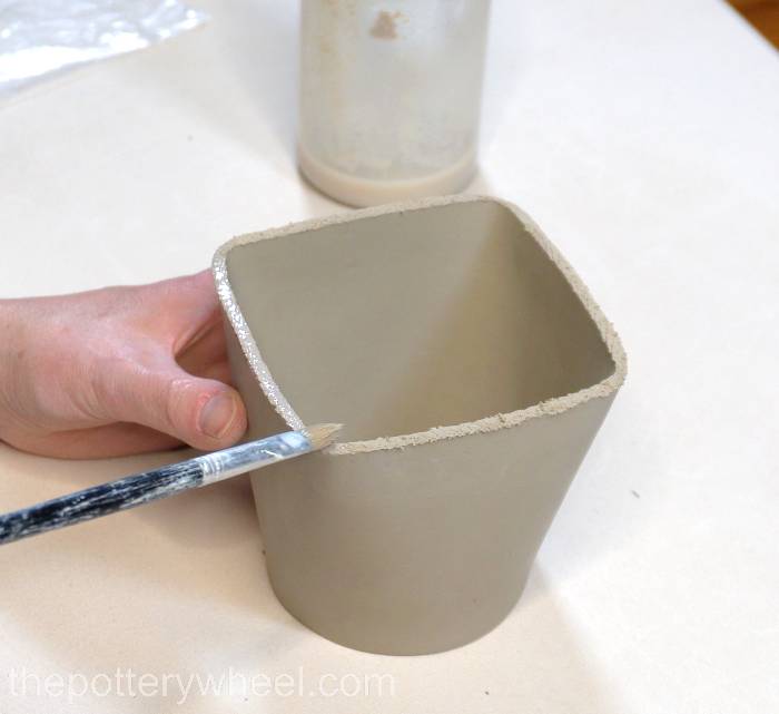 putting slip on the bottom edge of the slab mug