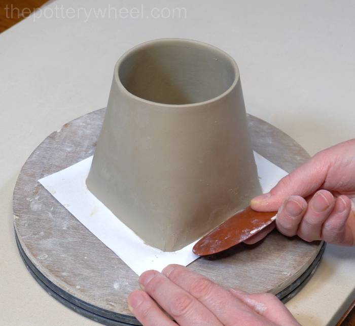 smoothing off the base of the square bottomed slab mug