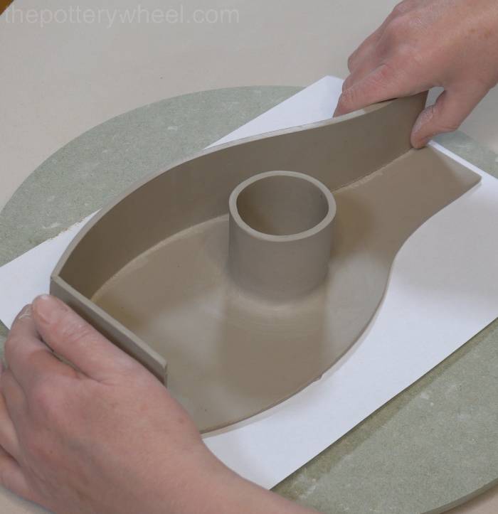 Shaping the side of the donut vase