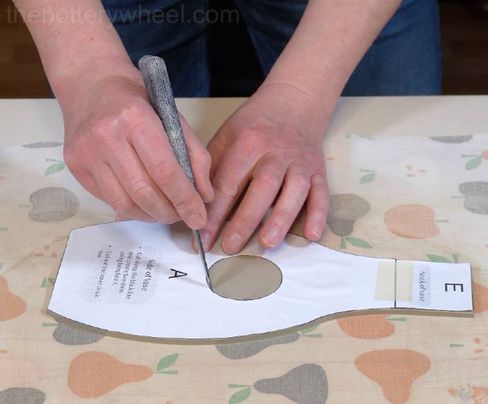 cutting out the inner circle of the donut vase