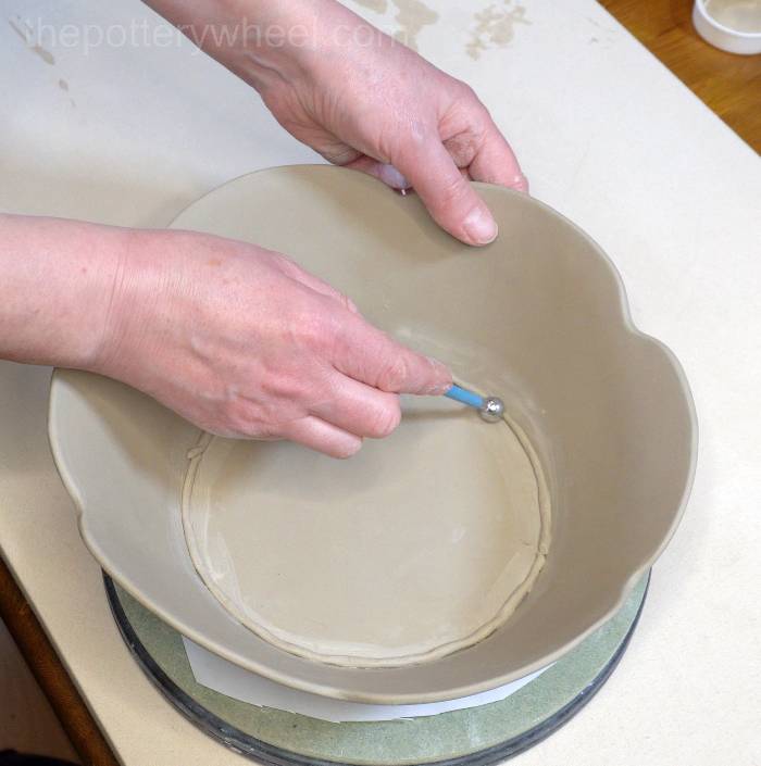 blending in the clay coil on the bowl