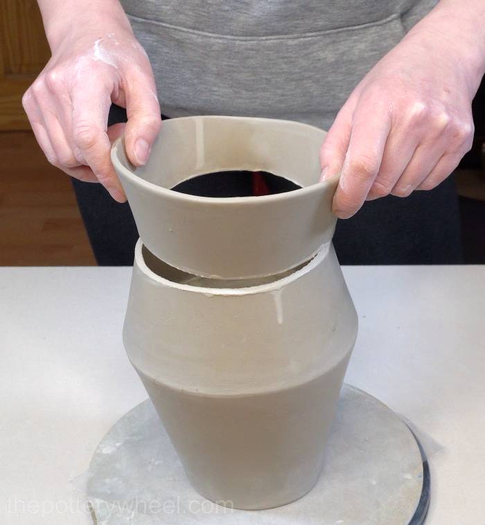 lowering the rim onto the jug