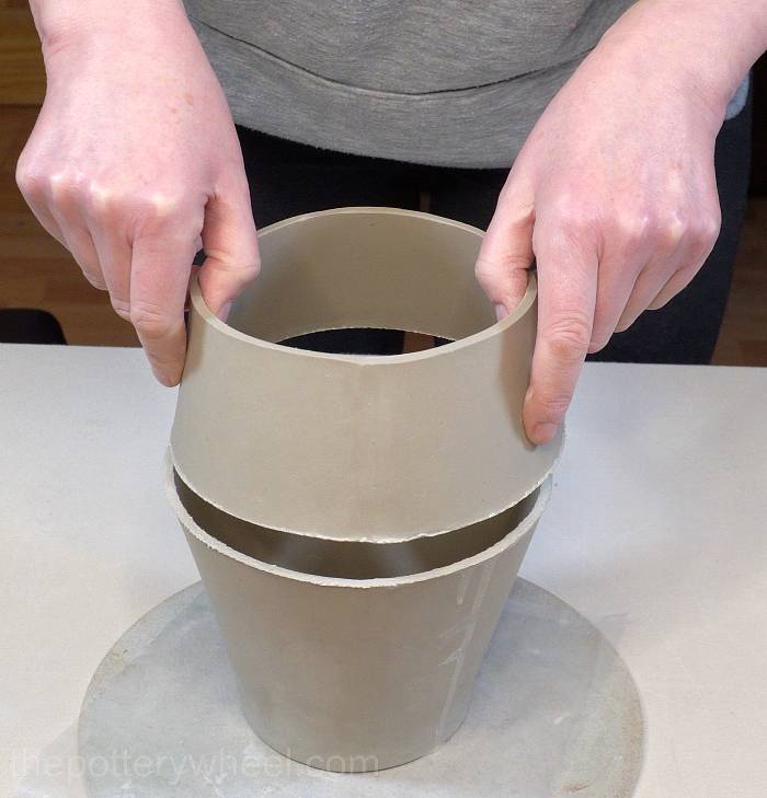 lowering the shoulder onto the base of the jug