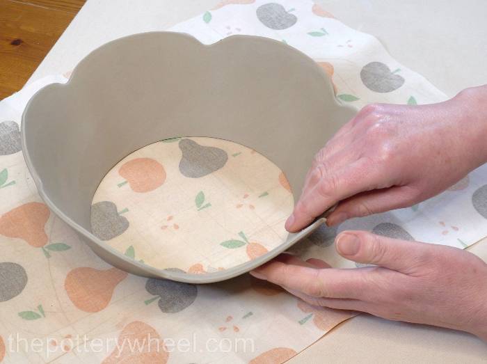 pressing the two edges of the slab together