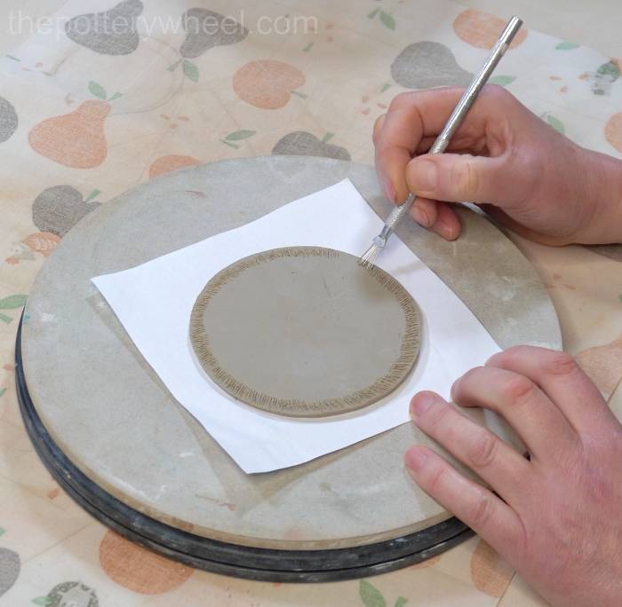 scoring the base of the jug