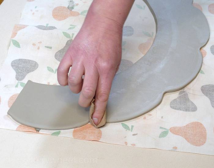 smoothing the top edge of the curved slab