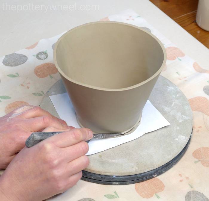 trimming the base of the jug