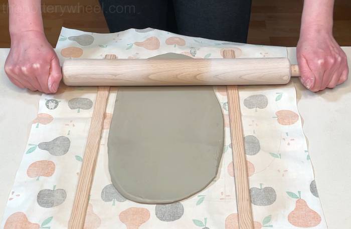 Rolling the slab for the heart shaped pottery mug