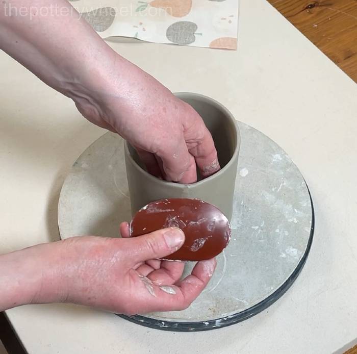 compressing the clay slab