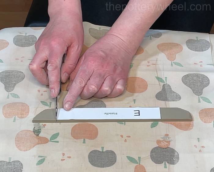 cutting the handle for the heart shaped slab mug
