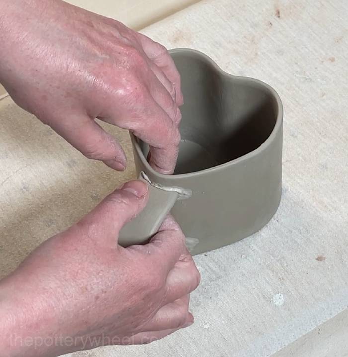 pressing the handle into position