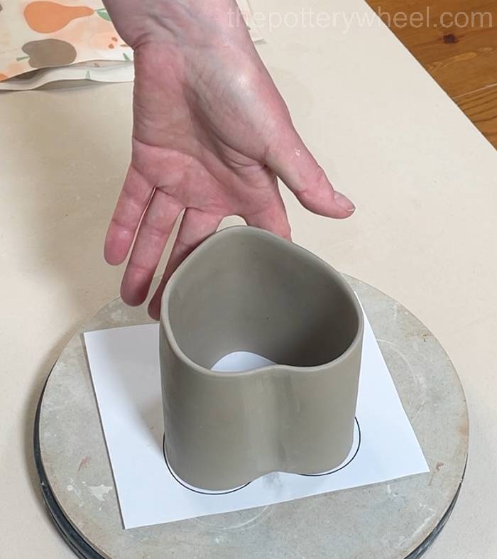 shaping the bottom section of the heart shaped slab pottery mug