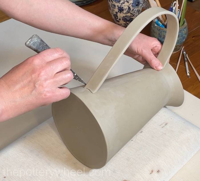 marking where the handle goes on the flower jug vase