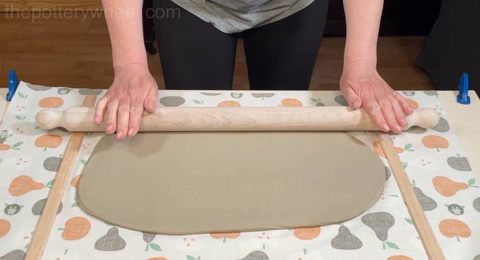 rolling a slab of clay