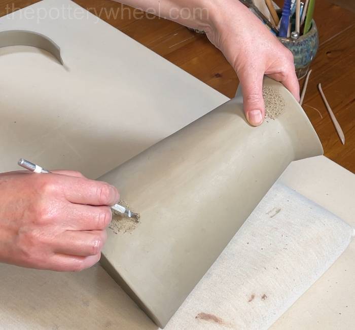 scoring into the side of the vase