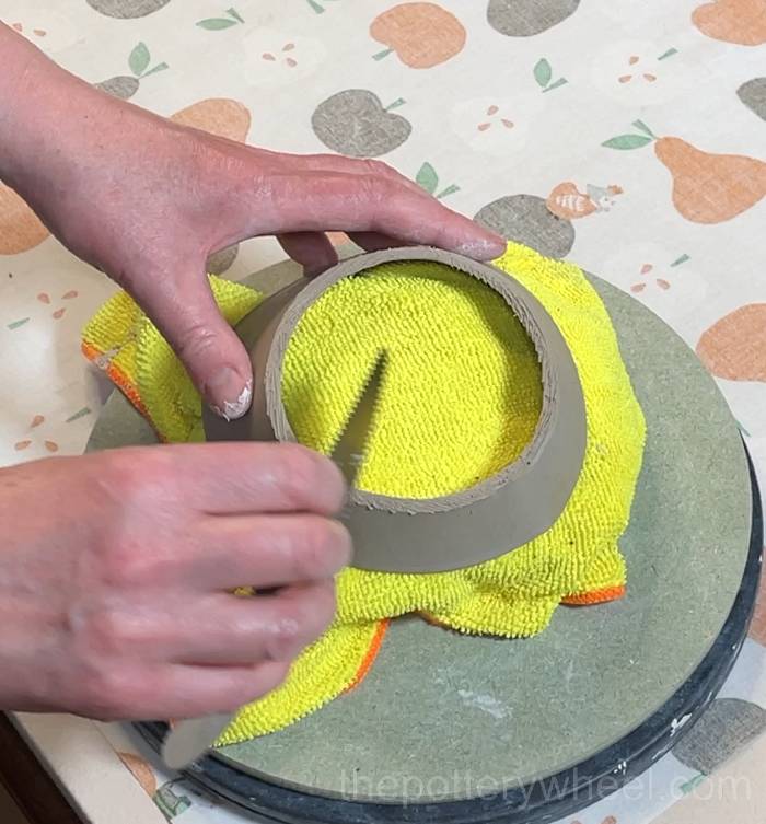scoring the underside of the flower jug vase rim