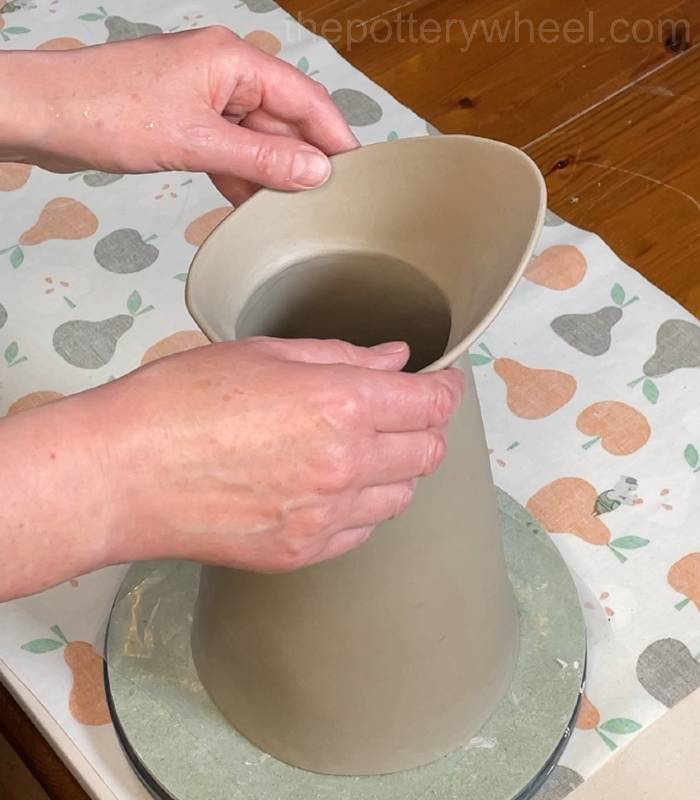 shaping the rim of the flower jug vase