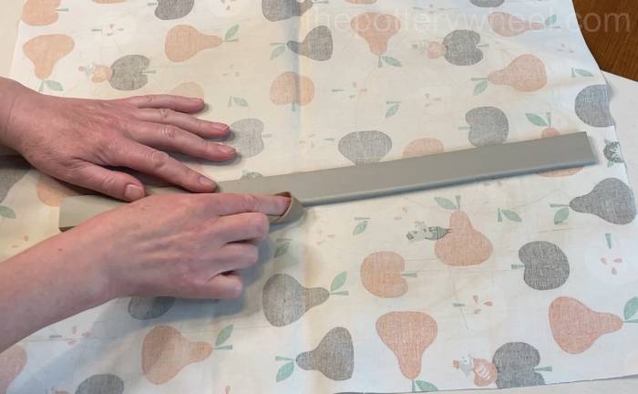 smoothing down the side of the handle