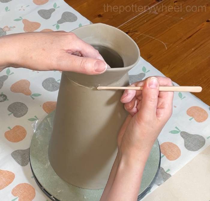 tidying up the join on the slab pottery vase