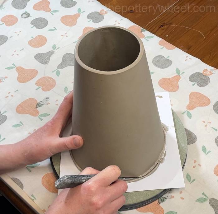 trimming the bottom edge of the flower jug vase