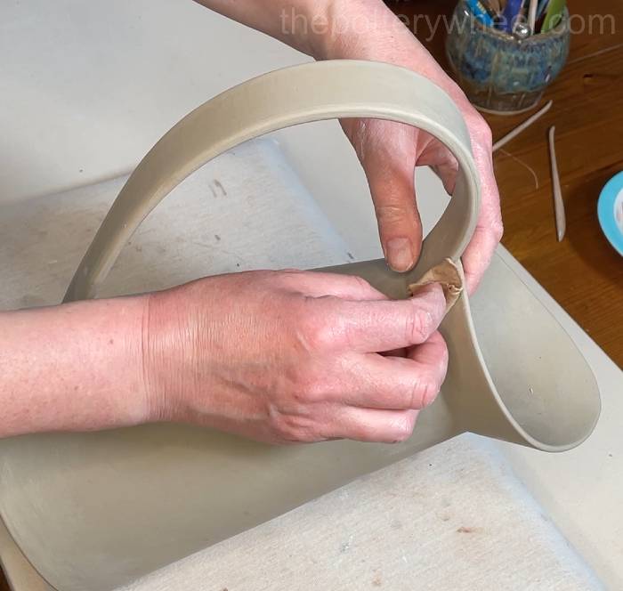 wiping down the clay handle