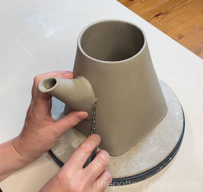 Marking where the spout is attached