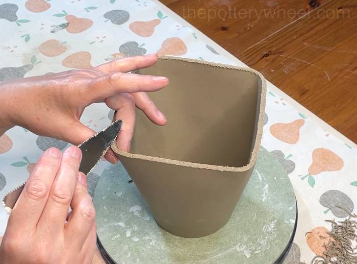 Scoring the bottom edge of the square-based teapot