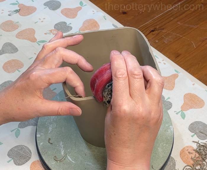 Shredding the base of the clay slab