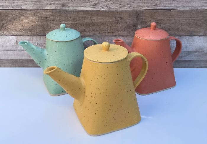 Square based pottery teapots made from templates