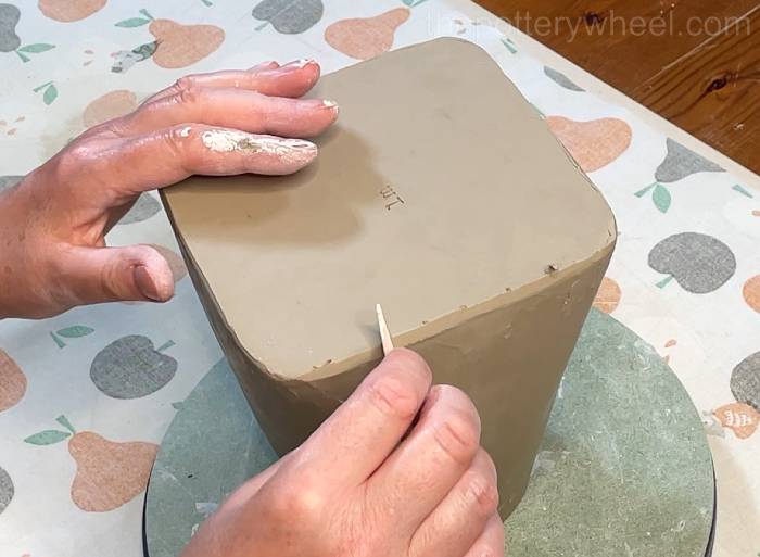 Tidying up the bottom of the square-based teapot