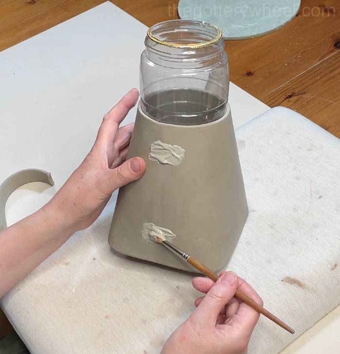 applying slip to attach the handle