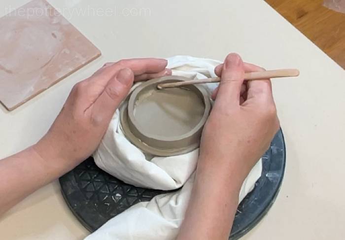 blending the rim onto the underside of the teapot lid