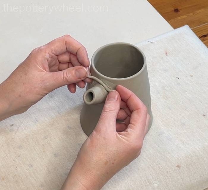Adding a coil to the pour-over coffee dripper spout