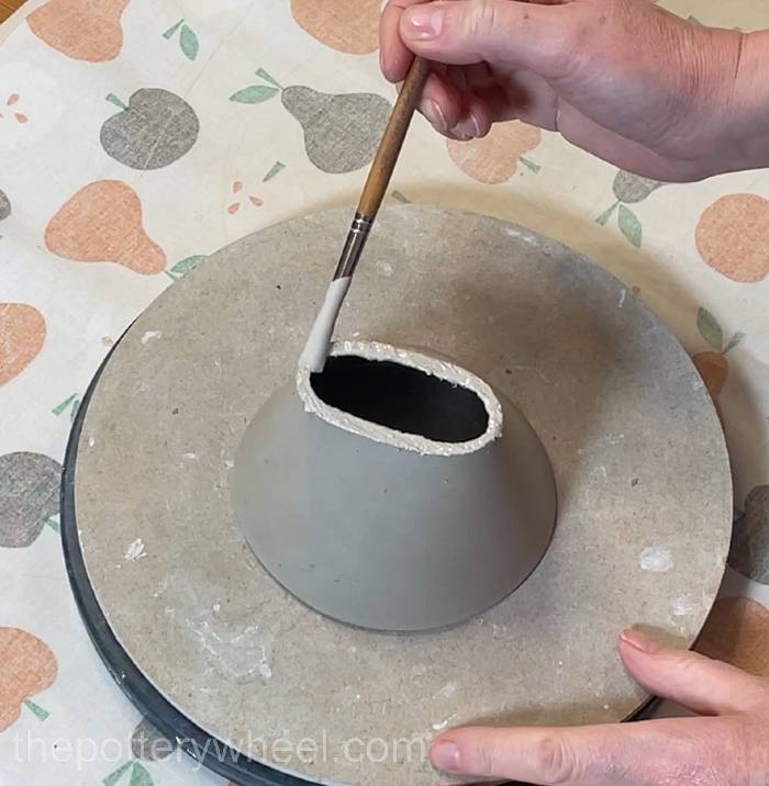 Applying slip to the base