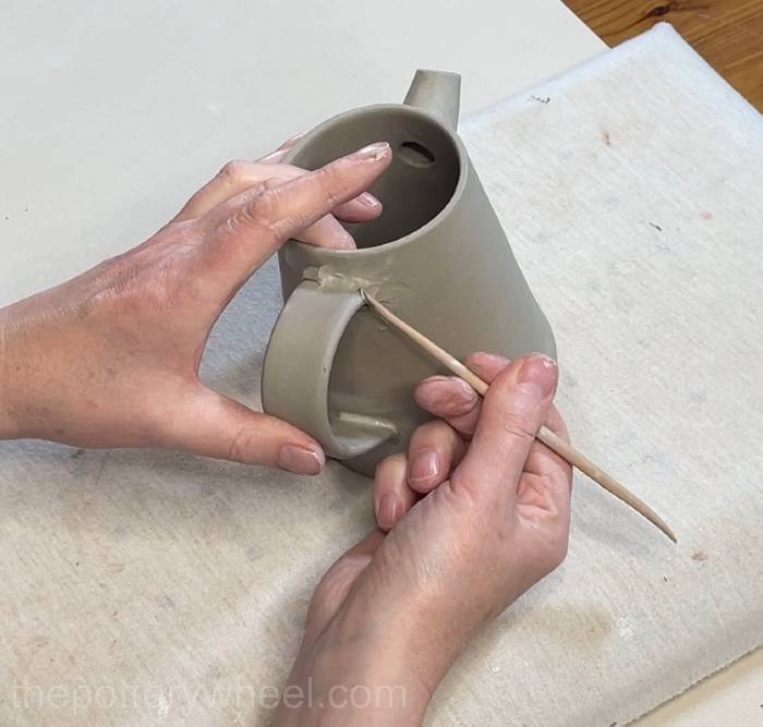 Blend the clay coil in around the handle