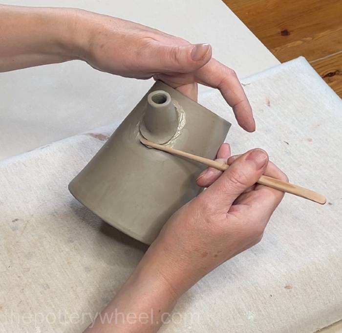 Blending the bottom edge of the spout