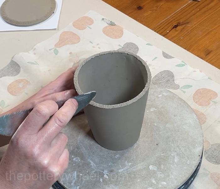 Score around the base of the pour over coffee jug