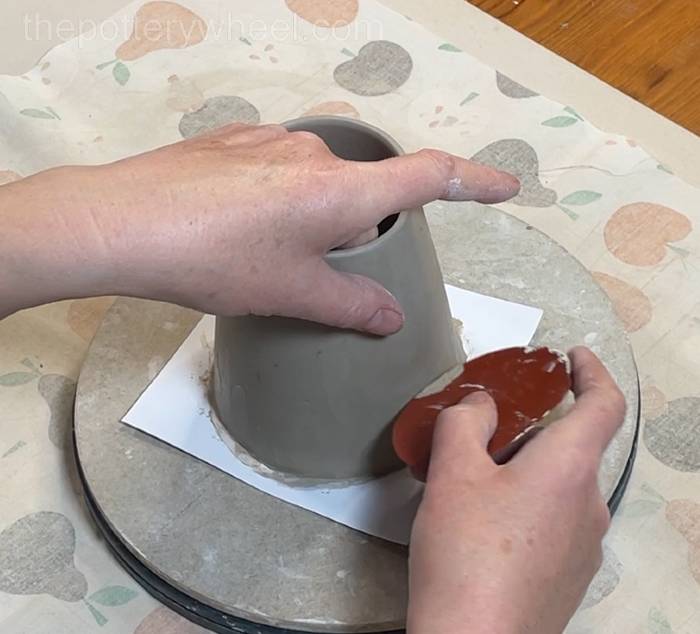 Tidying up the base of the pour-over coffee dripper jug
