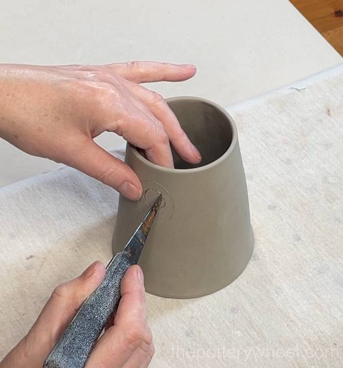 cutting out the hole for the spout