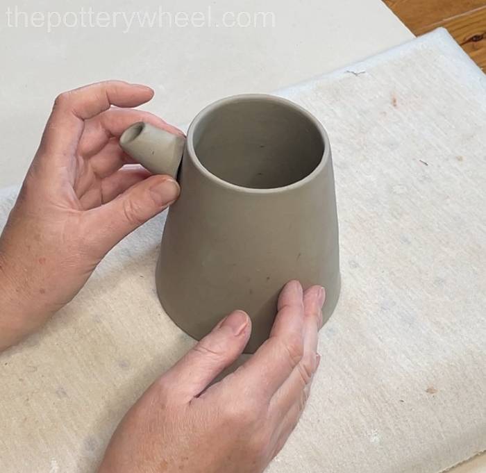 lining up the tip of the spout